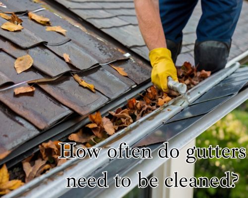Hand clearing from gutter.